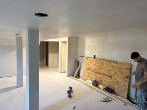 Hand Plastering Services MA & RI: Freshly applied hand plastering finish on walls and ceiling, creating smooth, elegant surfaces in a home renovation.