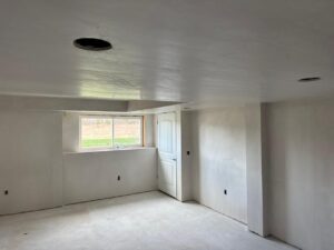 Hand Plastering Services MA & RI: Freshly applied hand plastering finish on walls and ceiling, creating smooth, elegant surfaces in a home renovation.