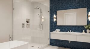 Tile Services MA & RI: Sleek bathroom featuring modern tile installation on walls and shower area, with geometric blue and classic white tiles.