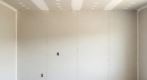 Drywall Services MA & RI: New drywall installation and finishing in progress, showcasing precise and smooth wall panels.