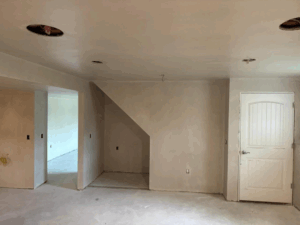 Hand Plastering Services MA & RI: Freshly applied hand plastering finish on walls and ceiling, creating smooth, elegant surfaces in a home renovation.